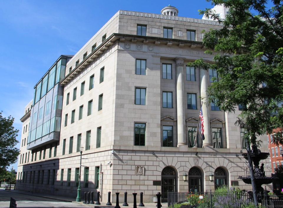 A large building with many windows on the side of it.