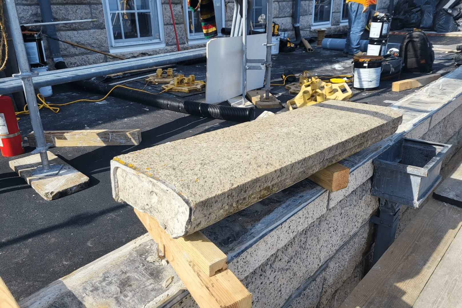 A pile of concrete on top of the ground.