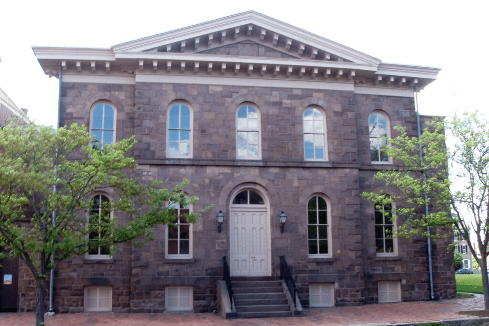 A large building with many windows and doors.