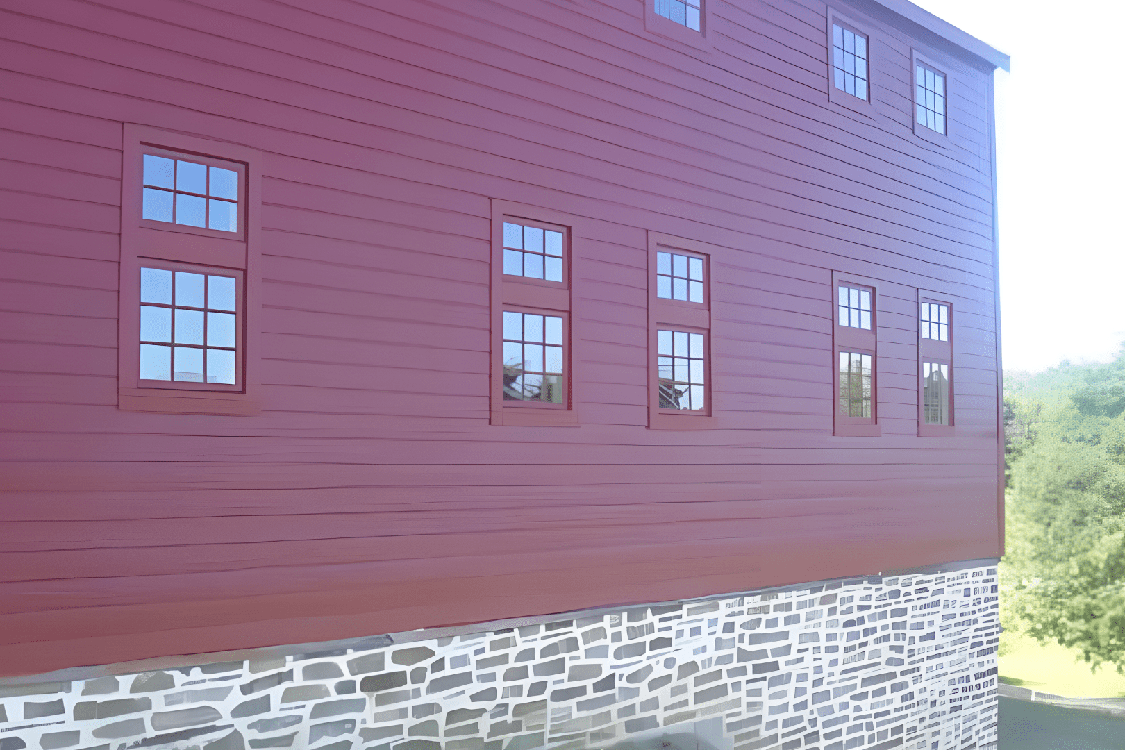 A red building with windows on the side of it.