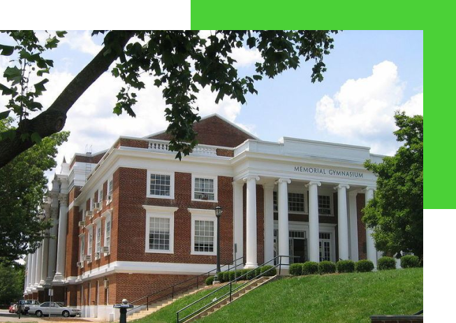 A large building with columns and green trim.